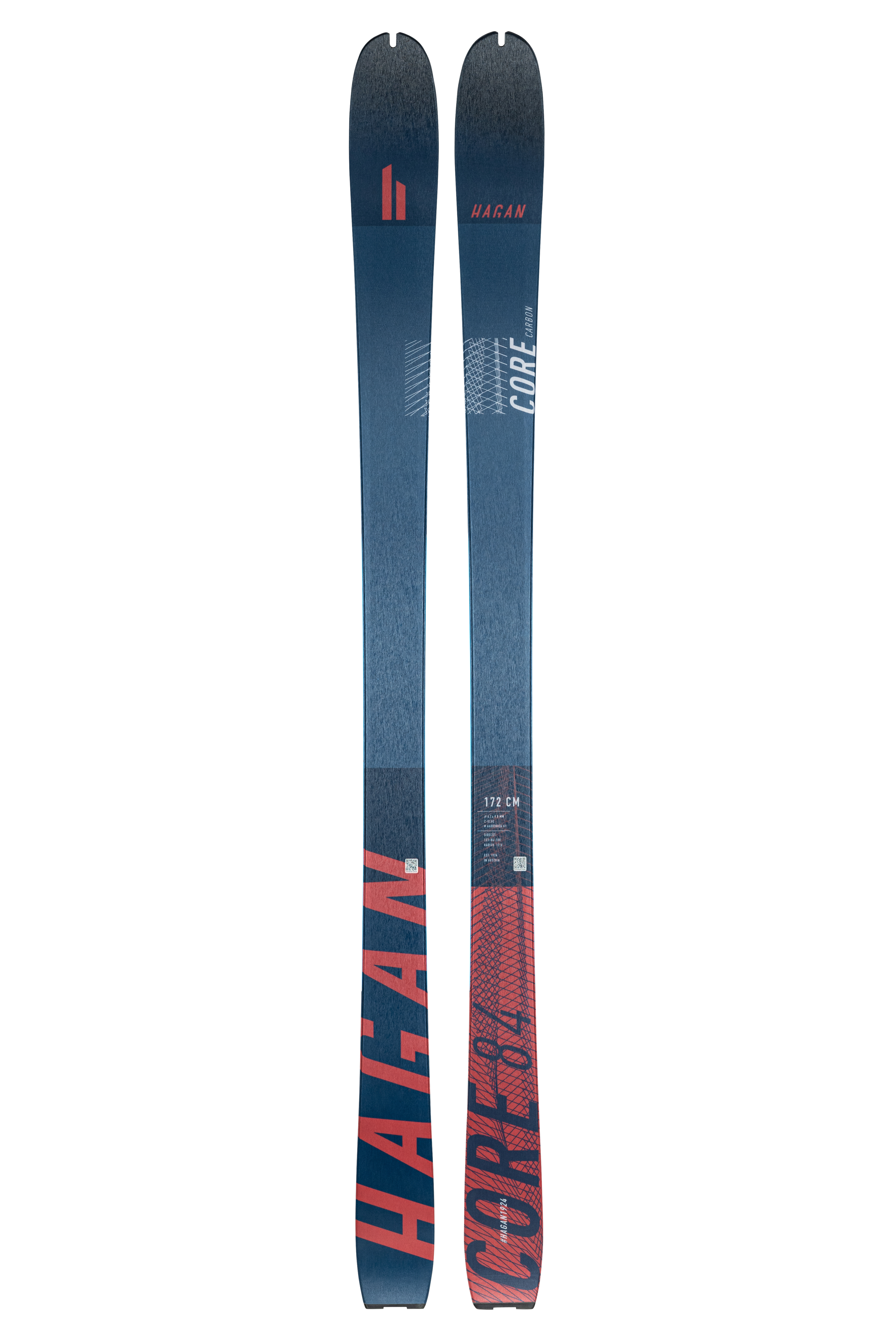 A pair of Hagan CORE CARBON 84 skis, primarily blue with red and white detailing, designed for all mountain touring.
